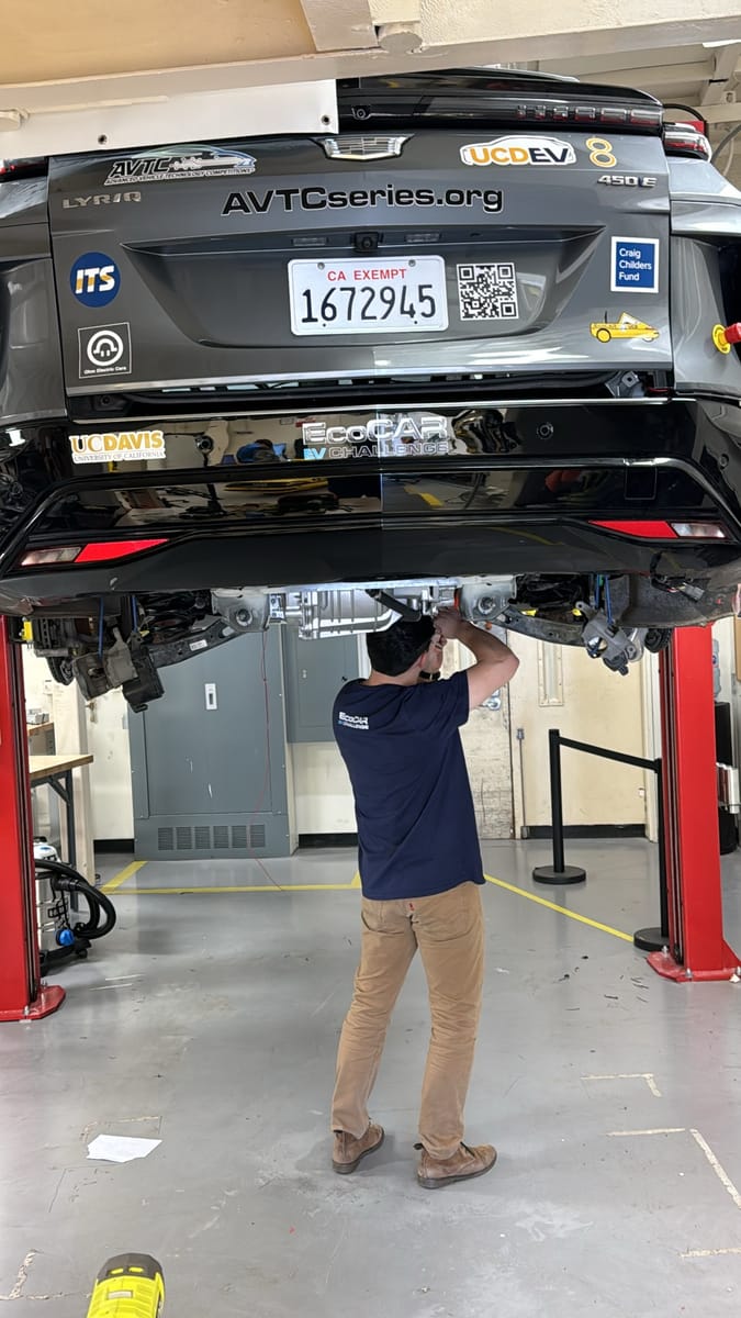 Working underneath the LYRIQ on the lift, rear drive unit exposed